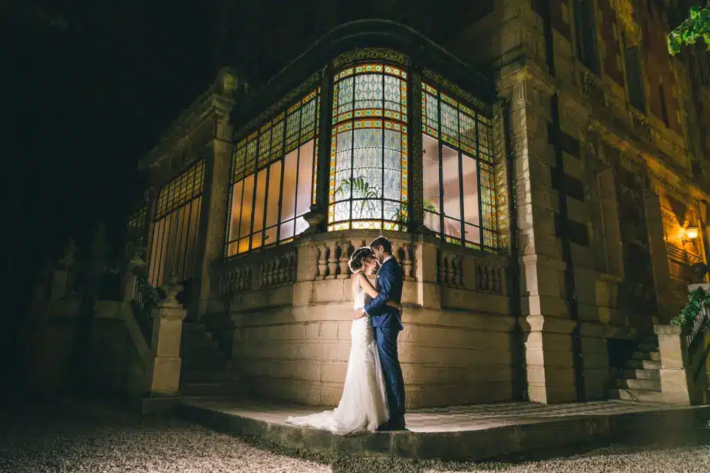 wedding at a private château in Provence at night, couple in front of Château La Beaumetane, destination wedding in South of France